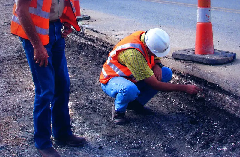 Men inspection road construction project